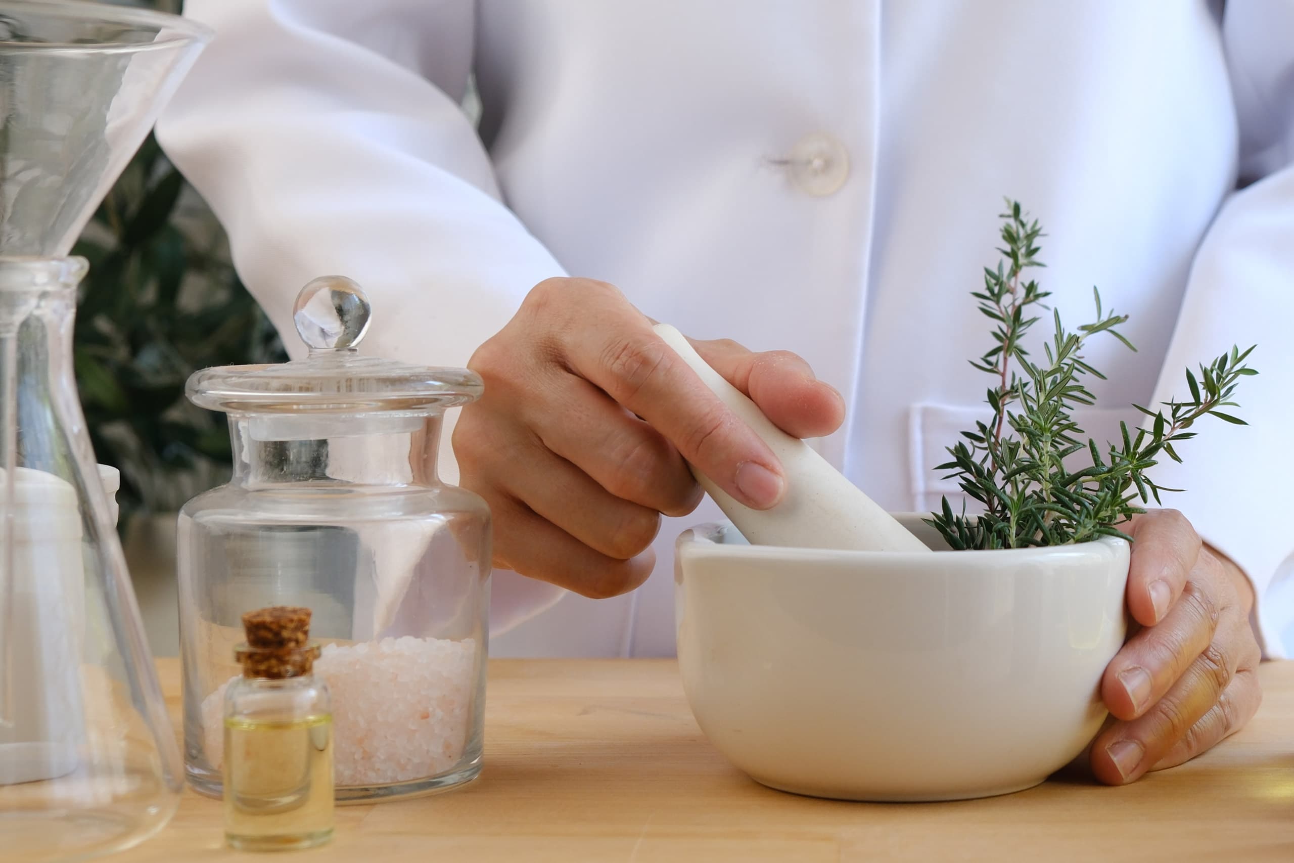 Pharmacist makes Wohl anti-inflammatory homeopatic tablets.jpg